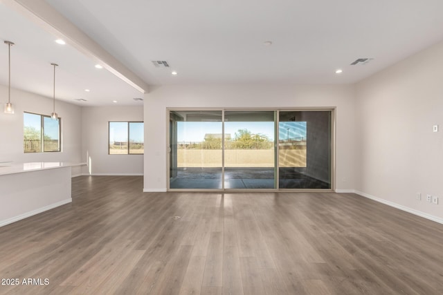 unfurnished room with hardwood / wood-style flooring