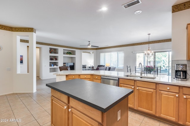 kitchen with dishwasher, a center island, ceiling fan with notable chandelier, and sink