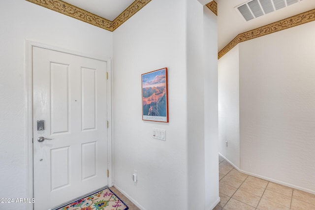 entryway with light tile patterned floors