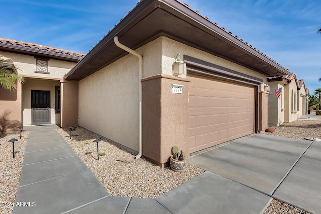 view of home's exterior with a garage