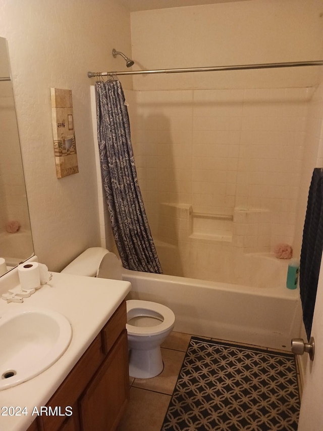 full bathroom featuring tile patterned floors, vanity, shower / tub combo, and toilet