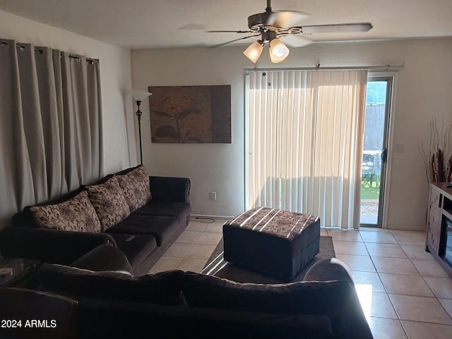 tiled living room featuring ceiling fan