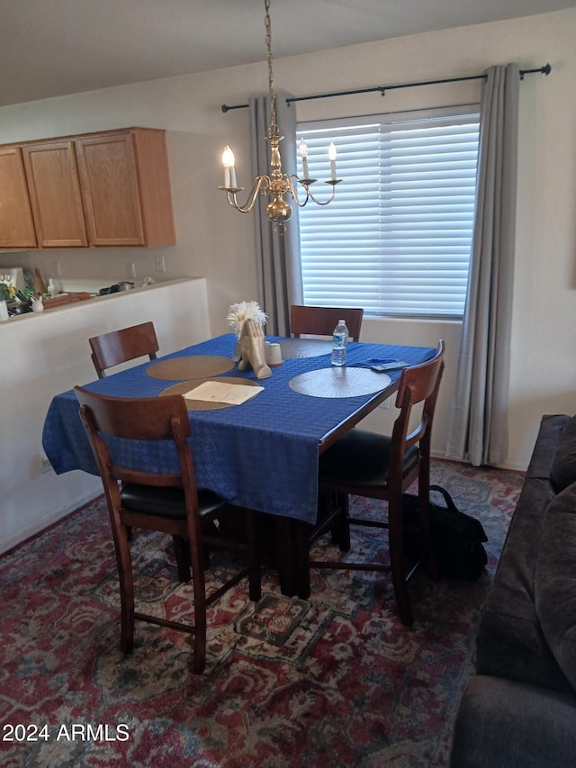 dining area featuring a notable chandelier