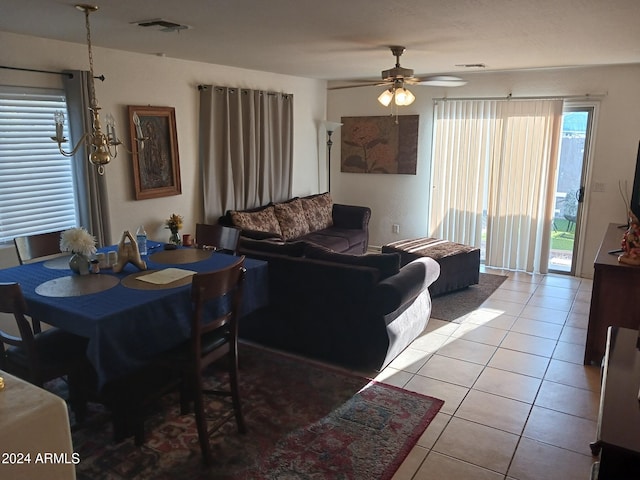 tiled living room with ceiling fan