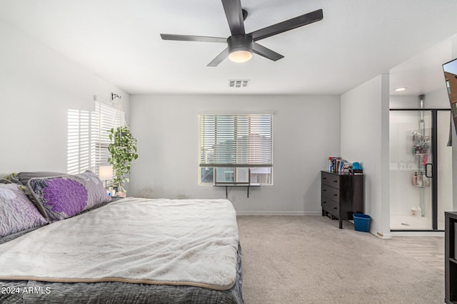 bedroom featuring light colored carpet and ceiling fan