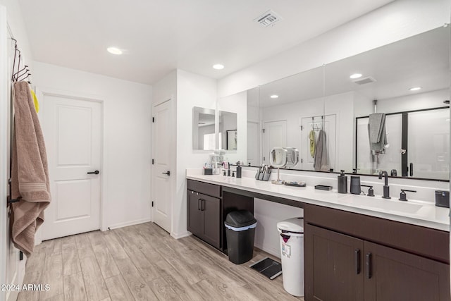 bathroom featuring hardwood / wood-style floors and vanity