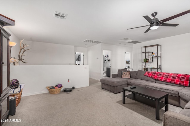 living room with ceiling fan and light carpet