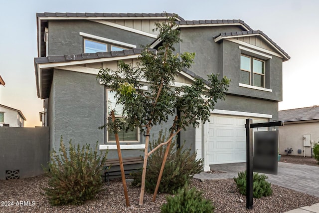 view of front of property with a garage