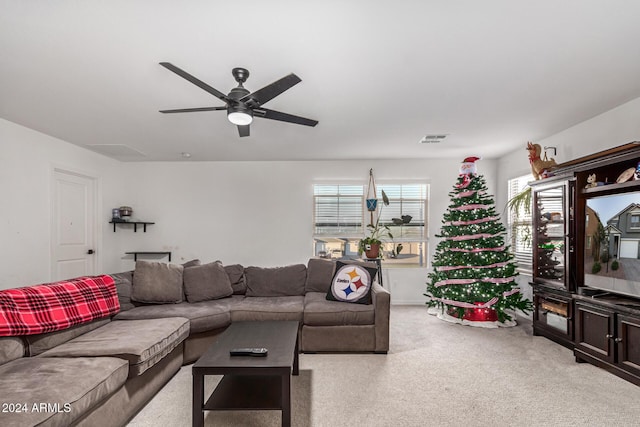 living room featuring ceiling fan and light colored carpet