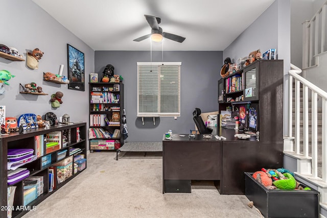 carpeted home office with ceiling fan