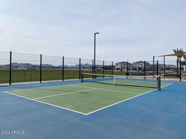 view of sport court with community basketball court and fence