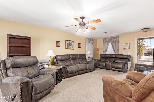 12426 W Surrey Ave, El Mirage, AZ 85335 - carpeted living area with a ceiling fan and visible vents