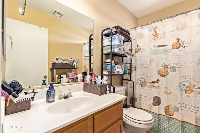 12426 W Surrey Ave, El Mirage, AZ 85335 - bathroom featuring toilet, vanity, a shower with shower curtain, and visible vents