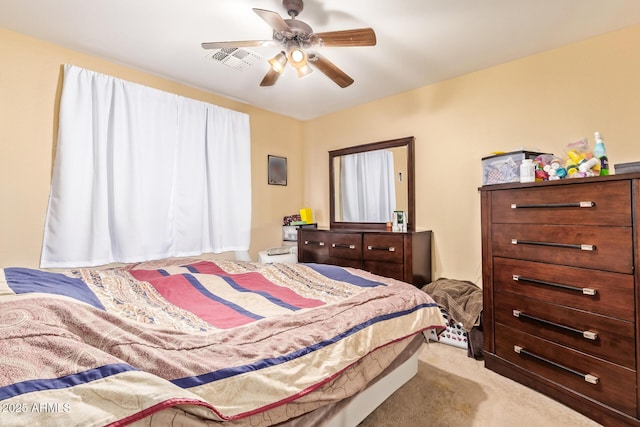 12426 W Surrey Ave, El Mirage, AZ 85335 - bedroom with carpet flooring, visible vents, and ceiling fan