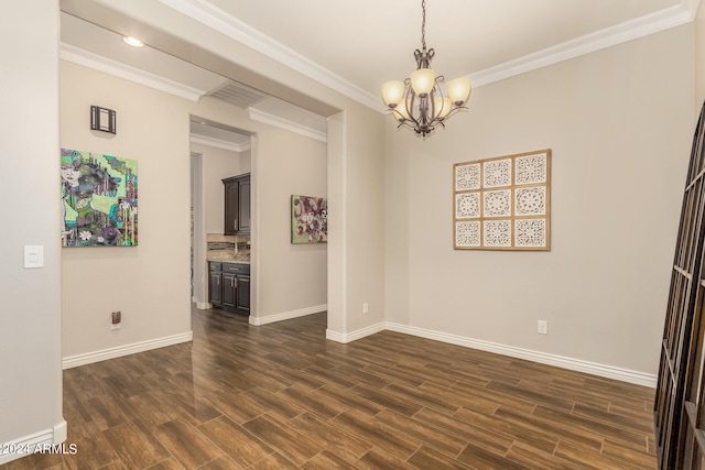 unfurnished room featuring ornamental molding, a chandelier, and dark wood-type flooring