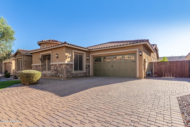 mediterranean / spanish-style house featuring a garage