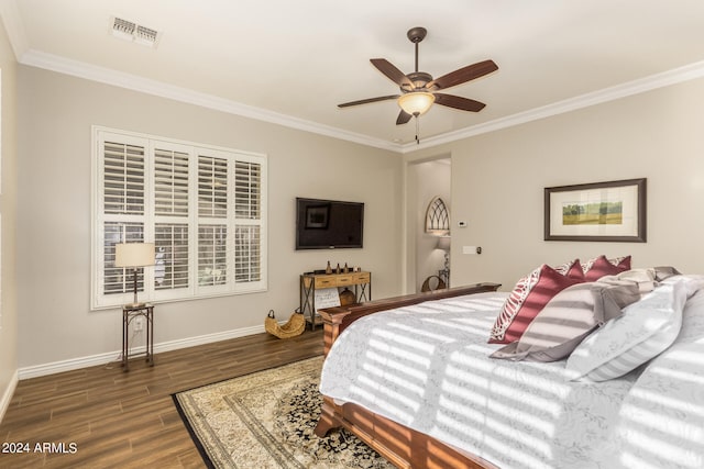 bedroom featuring ornamental molding, ceiling fan, and dark hardwood / wood-style flooring