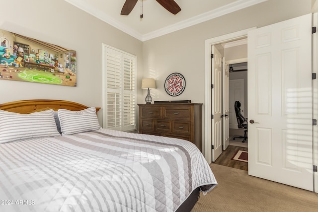 bedroom with crown molding, carpet floors, and ceiling fan