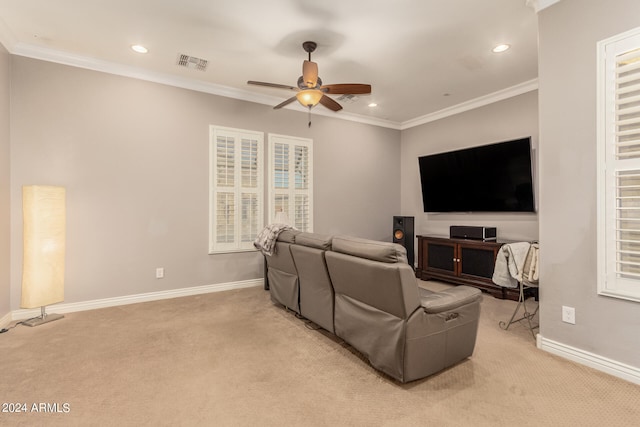 living room with crown molding, light carpet, and ceiling fan