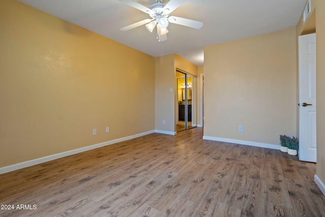 empty room featuring ceiling fan and hardwood / wood-style flooring