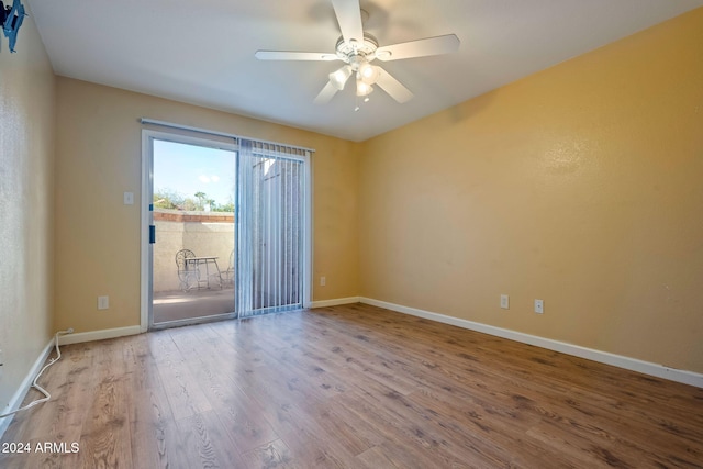 unfurnished room with hardwood / wood-style flooring and ceiling fan