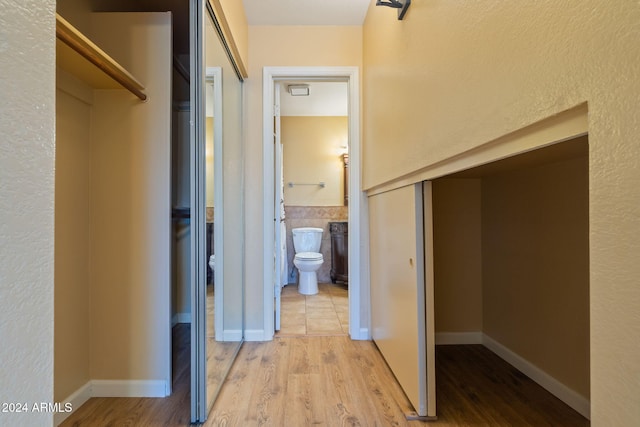 hallway featuring light hardwood / wood-style floors