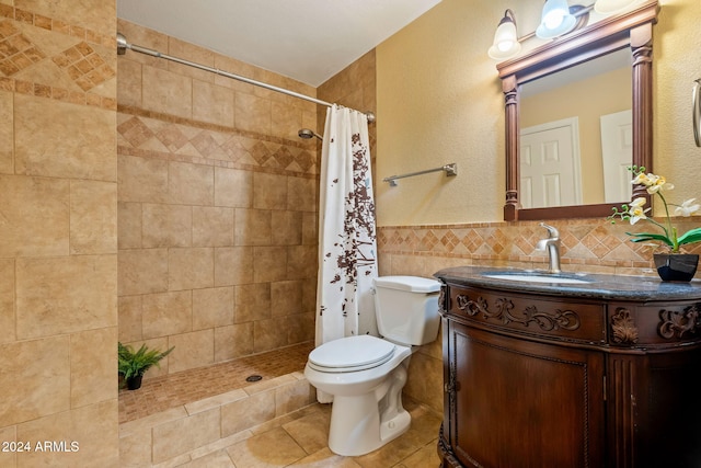 bathroom with a shower with shower curtain, vanity, toilet, and tile walls