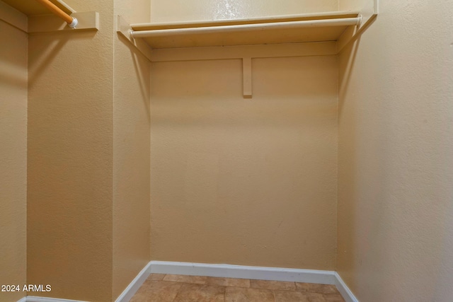 walk in closet featuring light tile patterned floors