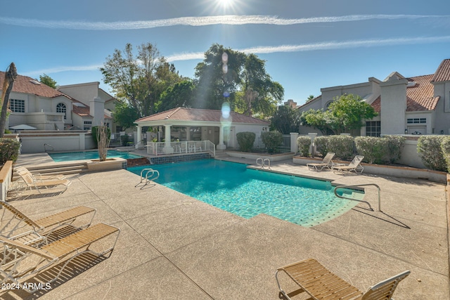 view of pool featuring a patio area