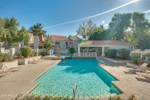 view of swimming pool with a patio area