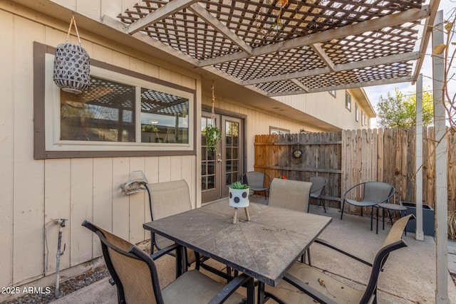 view of patio / terrace featuring french doors and a pergola