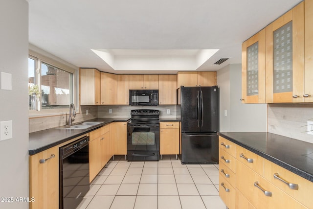 kitchen with sink, backsplash, black appliances, a raised ceiling, and light brown cabinets