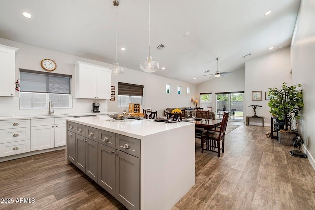1005 E Weldon Ave, Phoenix, AZ 85014 - kitchen with a sink, lofted ceiling, light countertops, a ceiling fan, and gray cabinets