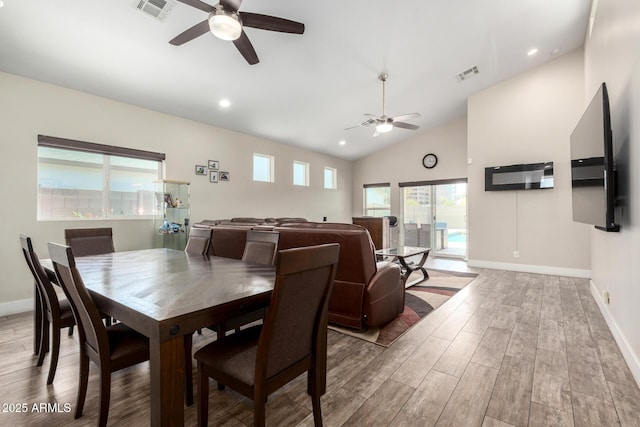 1005 E Weldon Ave, Phoenix, AZ 85014 - dining room featuring ceiling fan, wood finished floors, baseboards, vaulted ceiling, and recessed lighting