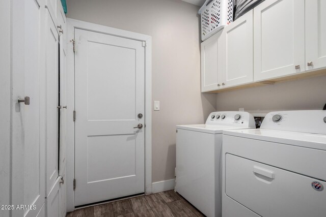 1005 E Weldon Ave, Phoenix, AZ 85014 - laundry area featuring cabinet space, washing machine and clothes dryer, dark wood-style floors, and baseboards