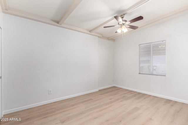 spare room with ceiling fan, beam ceiling, and light wood-type flooring