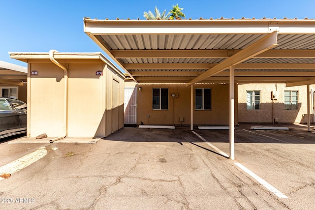 exterior space with a carport