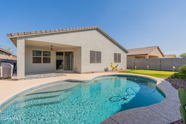 view of pool with ceiling fan and a patio