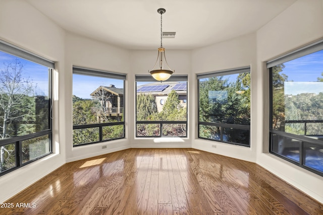 unfurnished sunroom with plenty of natural light