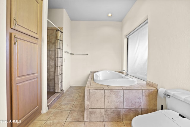 bathroom with toilet, tile patterned floors, and walk in shower