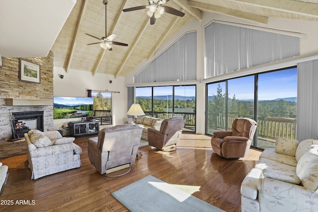 living room with beam ceiling, a fireplace, high vaulted ceiling, and wood-type flooring