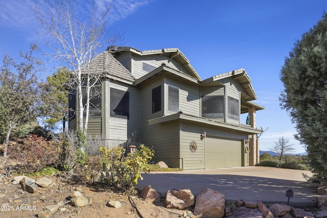 view of side of property with a garage