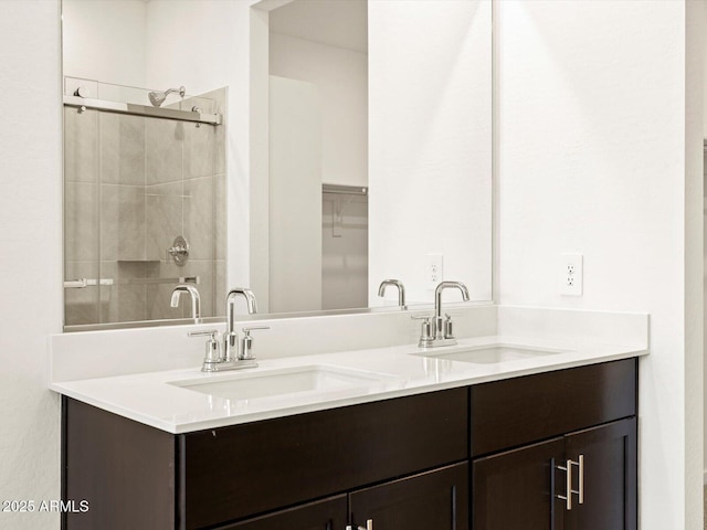 bathroom with vanity and an enclosed shower