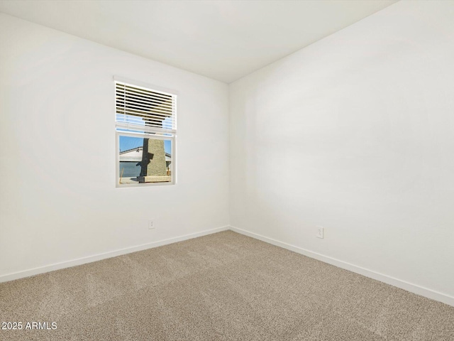 unfurnished room with carpet flooring