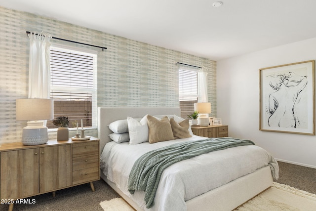 carpeted bedroom with baseboards and wallpapered walls