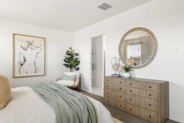 bedroom with visible vents, carpet flooring, and baseboards