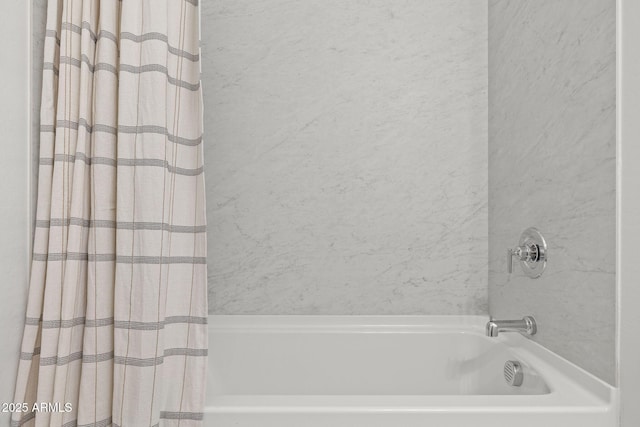 bathroom with shower / bathtub combination with curtain
