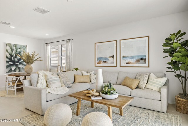 living room with visible vents, recessed lighting, and light tile patterned floors