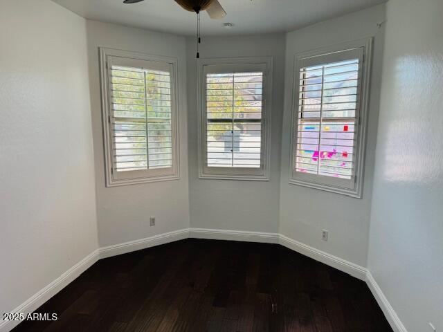 3502 W Belle Ave, San Tan Valley, AZ 85144 - empty room featuring dark wood finished floors, baseboards, and a ceiling fan