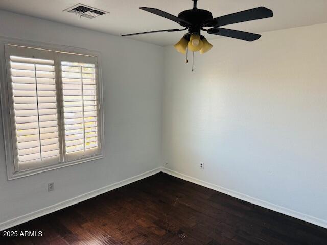 3502 W Belle Ave, San Tan Valley, AZ 85144 - empty room with baseboards, dark wood-style flooring, and a ceiling fan